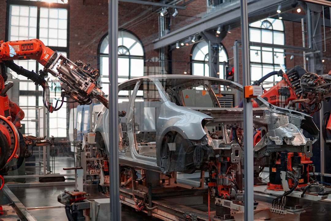 Robotic arms assembling automotive parts on a production line