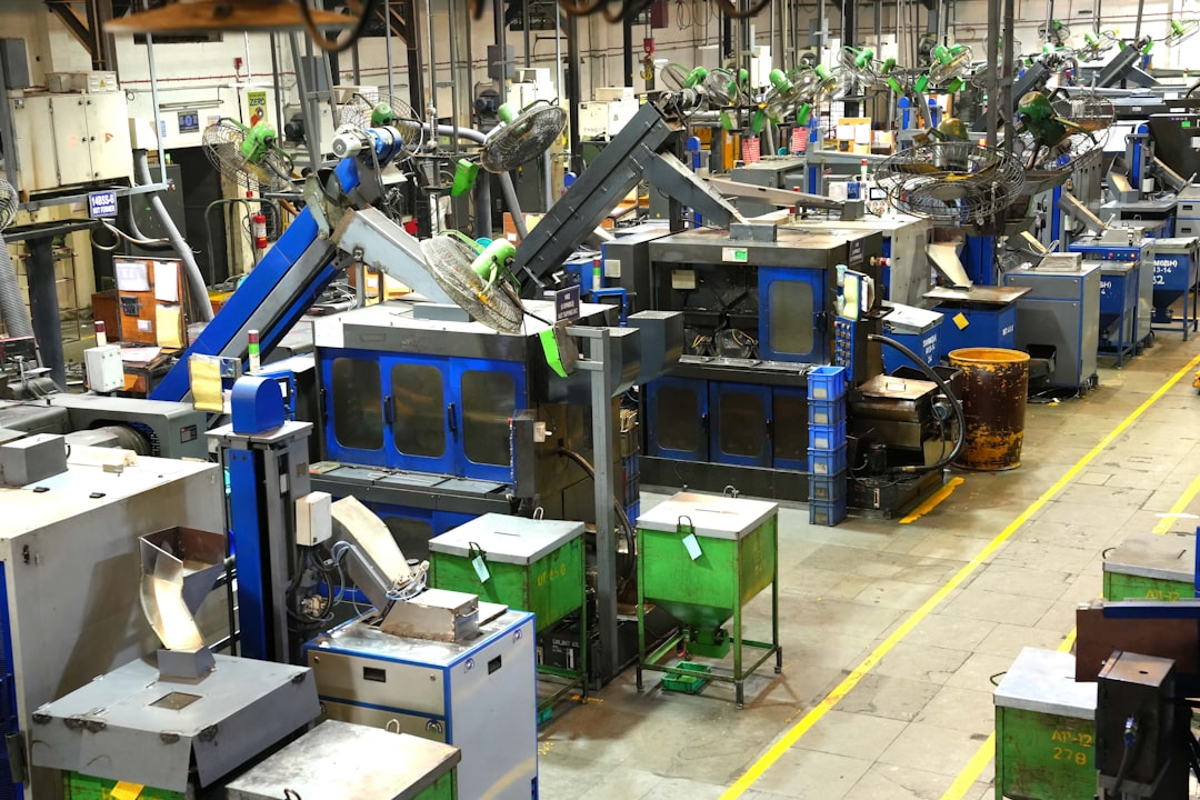 Industrial engineer monitoring AI quality dashboard in factory
