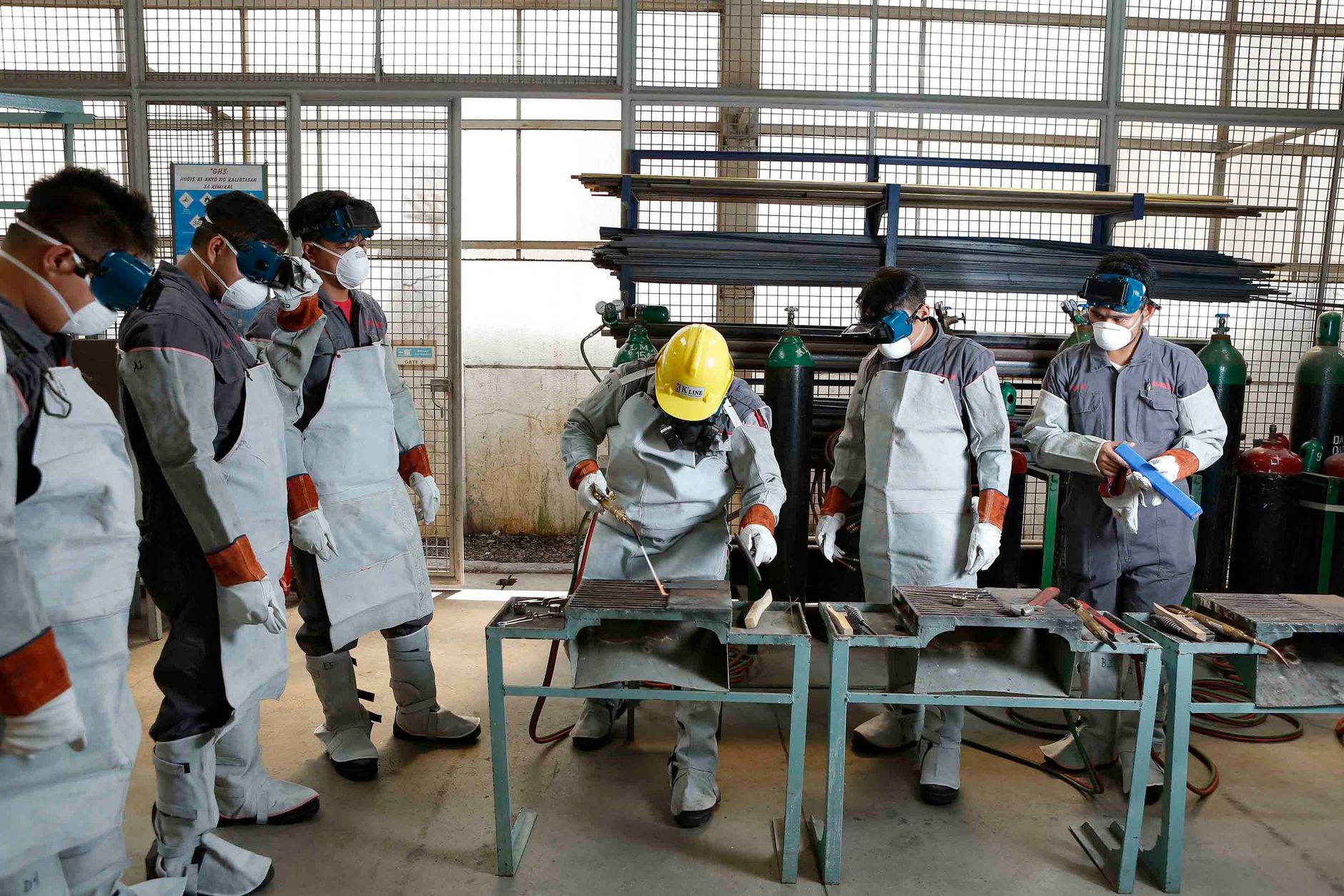 Employees receiving digital skills training in a smart factory environment
