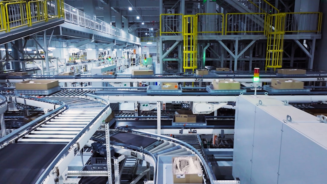 Factory floor dashboard showing real-time IoT data and OEE metrics on a large monitor