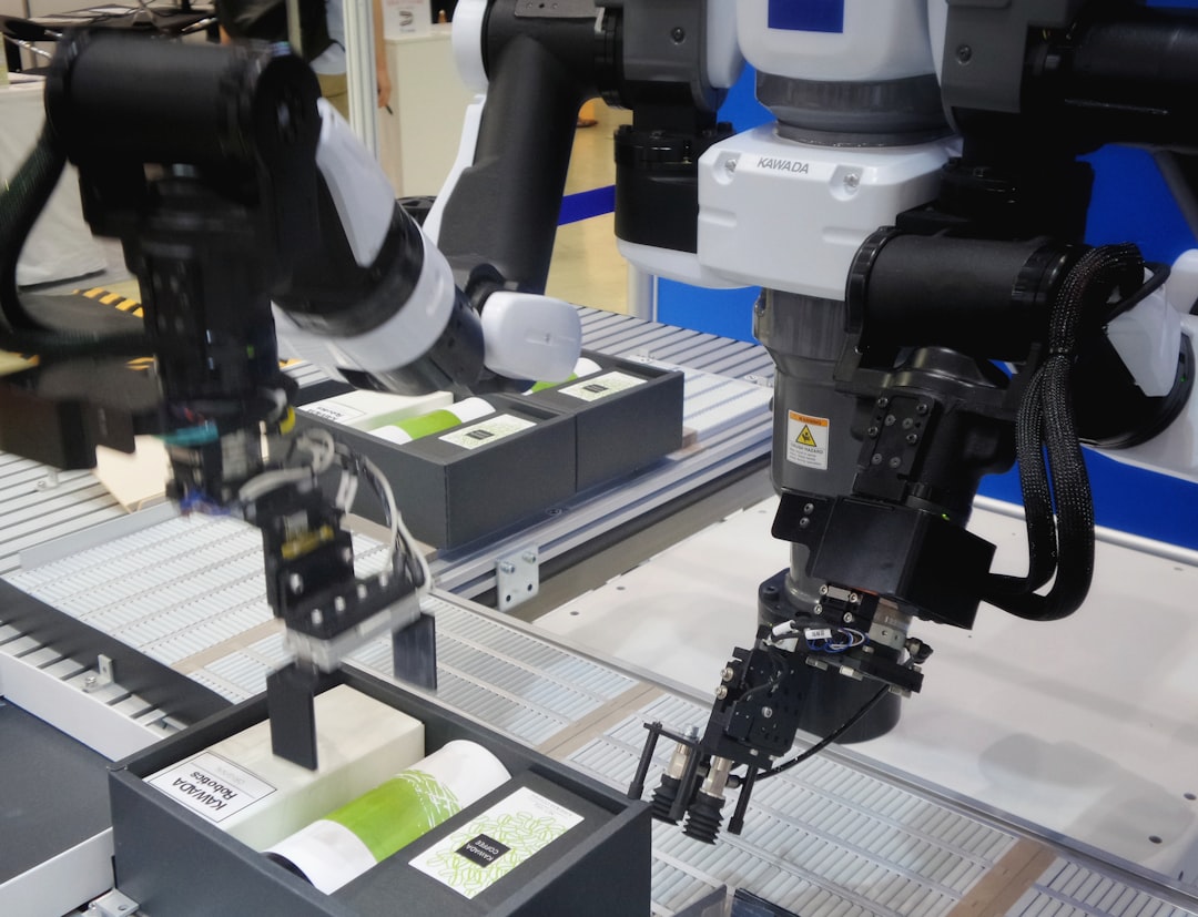 Factory owner reviewing IoT implementation checklist on a tablet in a modern production facility