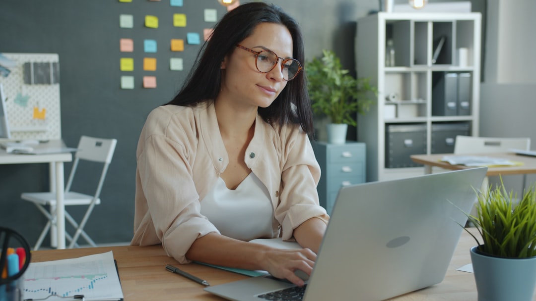 Small business team using Google Workspace alternative tools on laptops