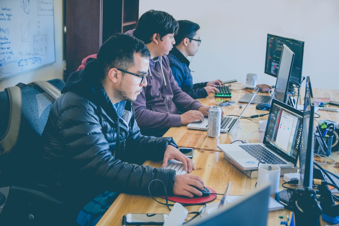 Small team collaborating in an AI workspace replacing multiple SaaS tools