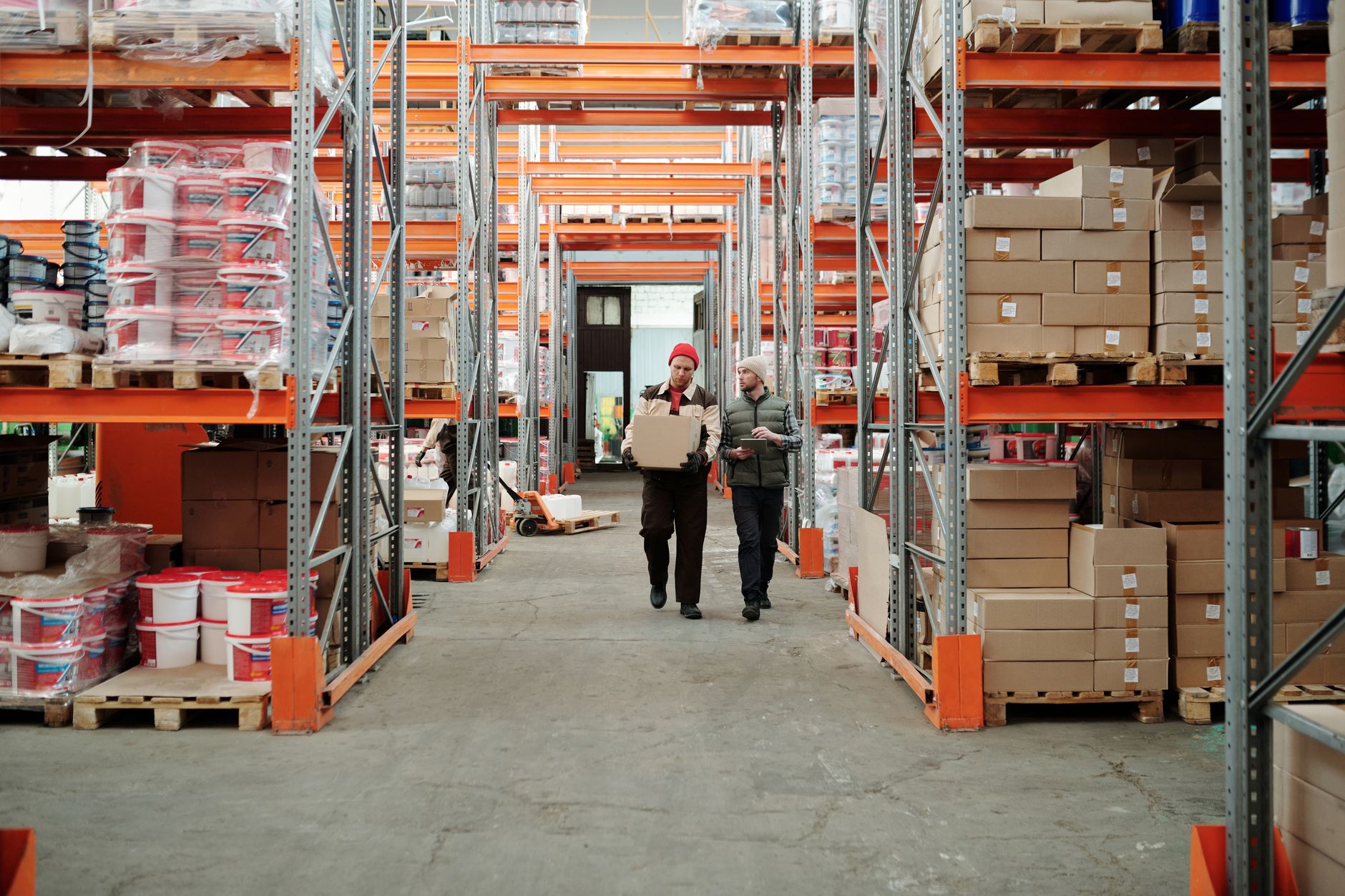 Warehouse team using tablets to monitor inventory KPIs and automation in 2026